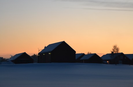 Farmhouses, winter sunset, under crescent moon