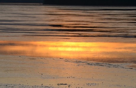 Sunset on icy river